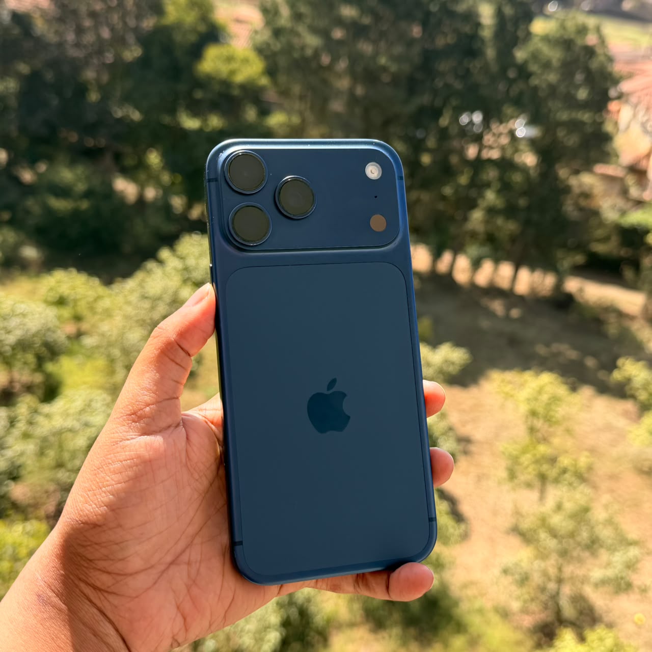 Checking a used iPhone 17 Pro in Deep Blue before sale at iTey Store Nairobi